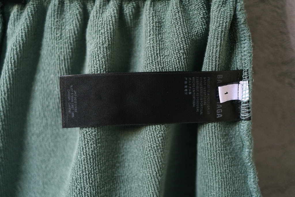 Balenciaga light teal shorts with interior care label and waistband stitching