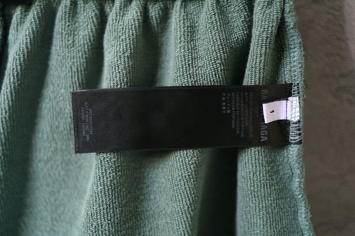 Balenciaga light teal shorts with interior care label and waistband stitching