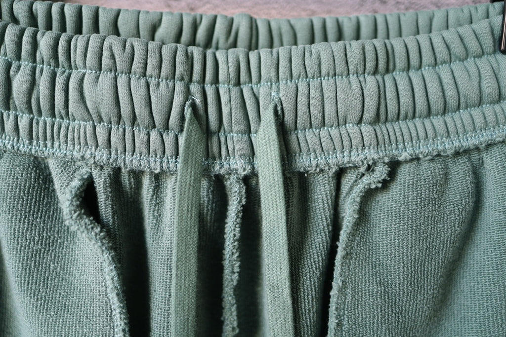 Balenciaga light teal shorts with elastic waist and front drawstring cords