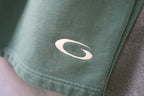 Balenciaga light teal shorts with oval logo on front hem detail