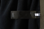 Black pants with internal care label near the waistband