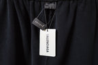 Black Balenciaga pants with hangtag and size label at waistband