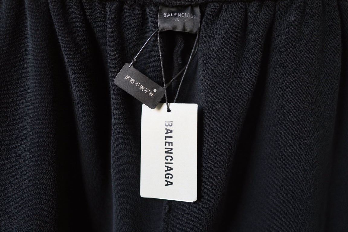 Black Balenciaga pants with hangtag and size label at waistband