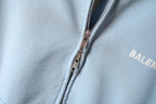 Balenciaga light blue hoodie close-up of front zipper and logo