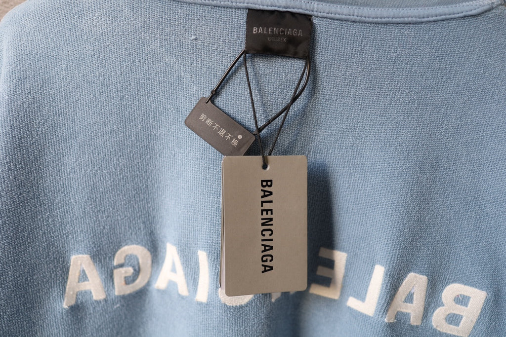 Balenciaga light blue hoodie with printed letters and neck label tags