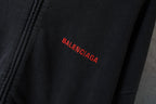 Red Balenciaga logo on black hoodie front panel