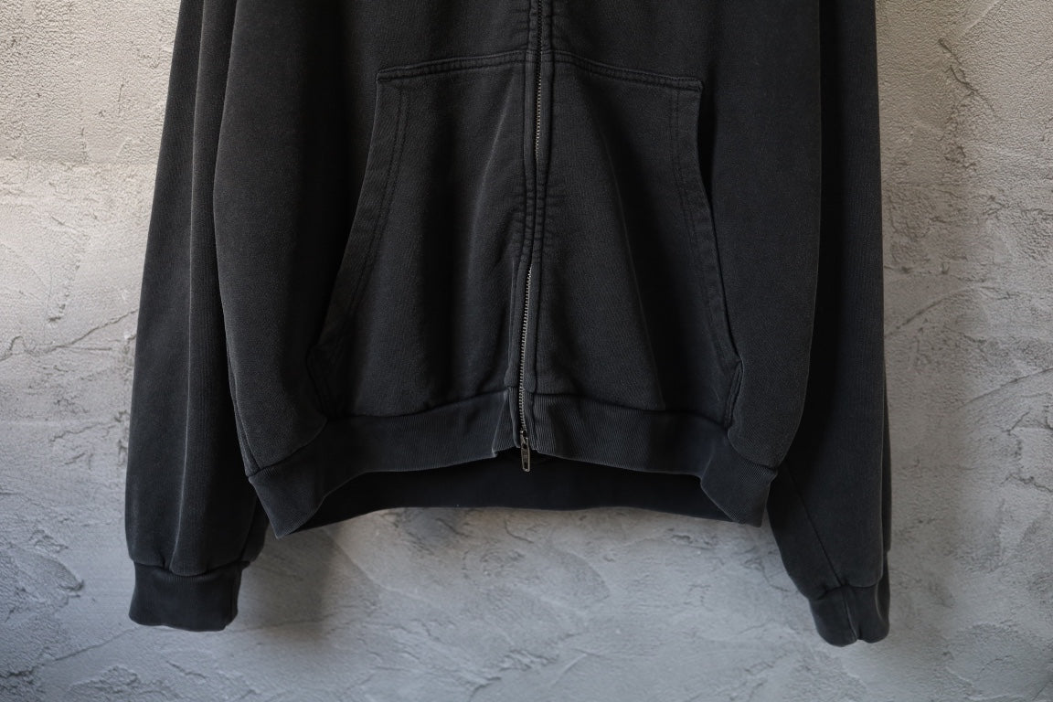 Black hoodie with front pouch pocket and drawstring at hem