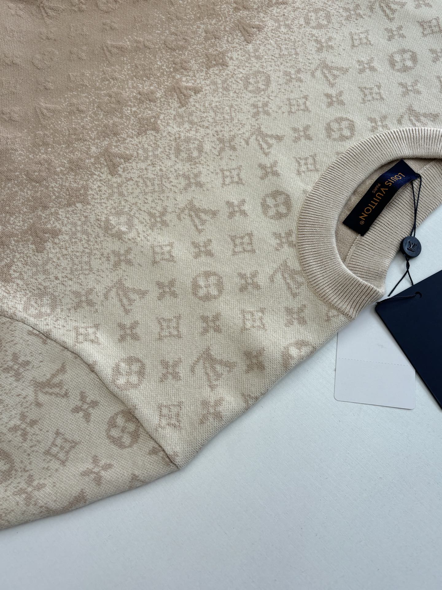 Light beige sweater collar with inner neck label