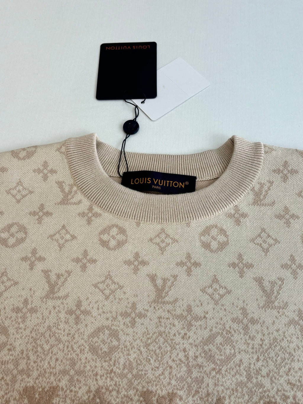 Light beige monogram sweater neckline with ribbed collar