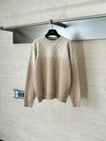 Light beige monogram long-sleeve sweater on hanger