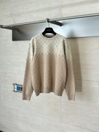 Light beige monogram long-sleeve sweater on hanger
