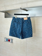 Louis Vuitton blue monogram denim shorts, with front pockets and button closure.