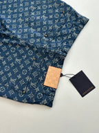 Louis Vuitton blue monogram denim shorts with hang tag, front pocket and button placket.