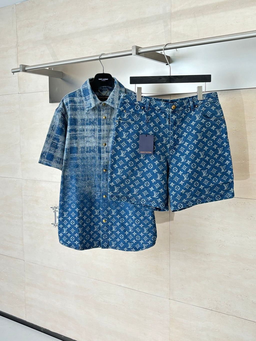 Louis Vuitton denim shorts in blue with monogram pattern, front button and zip.