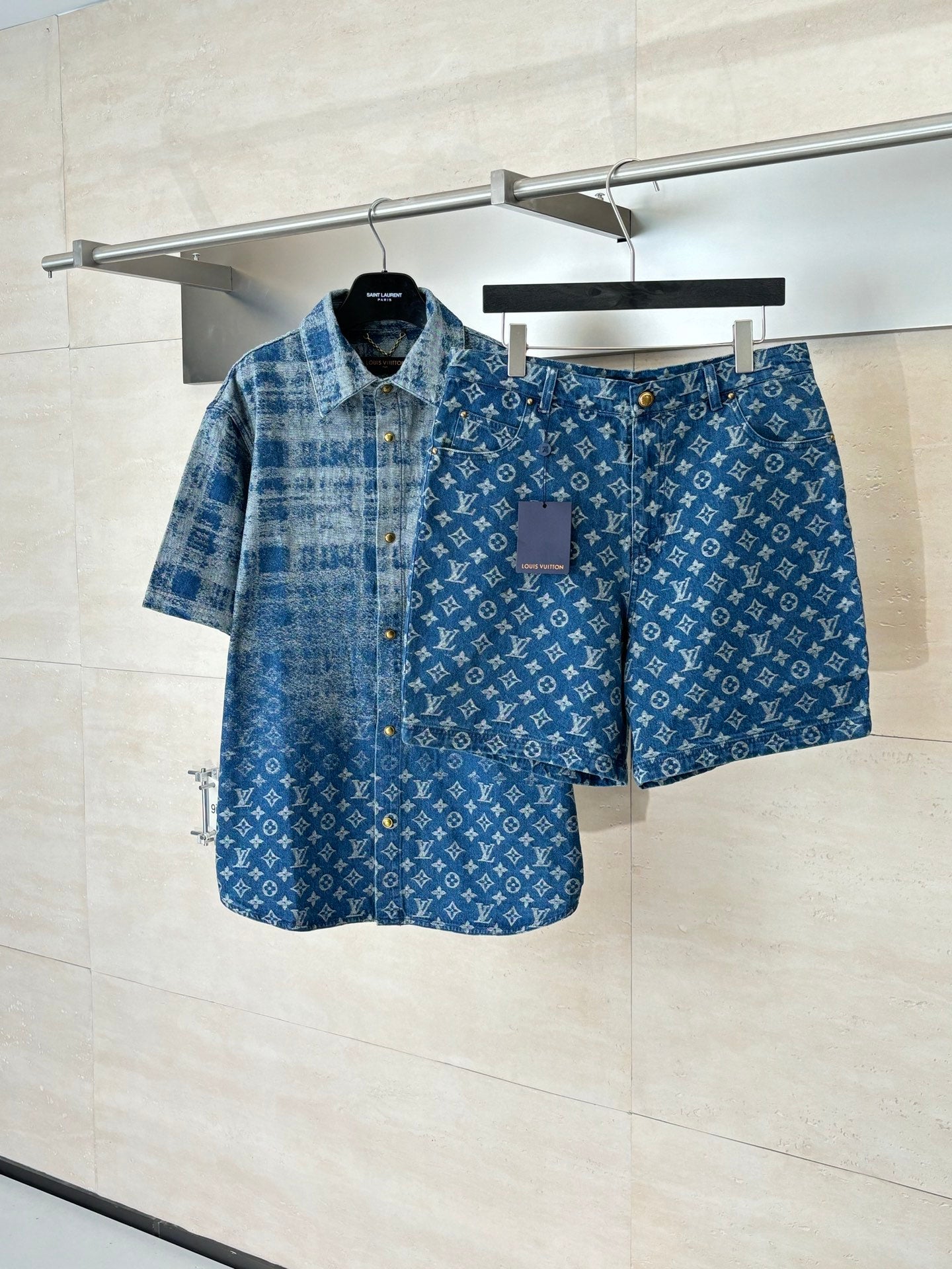 Louis Vuitton denim shorts in blue with monogram pattern, front button and zip.