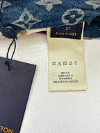 Louis Vuitton denim shorts with monogram print, care label and size tag visible