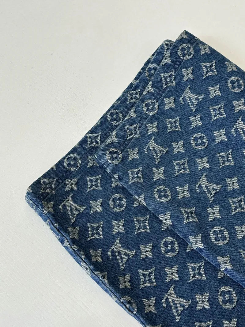 Louis Vuitton monogram denim shorts folded view, blue patterned fabric