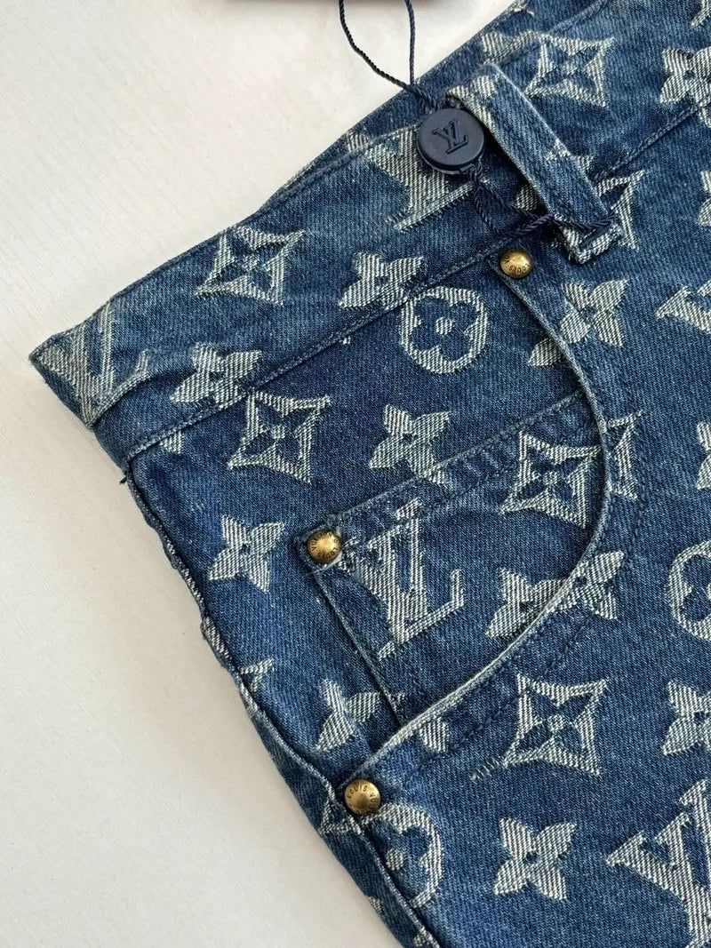 Louis Vuitton monogram denim shorts close-up of front pocket and metal buttons