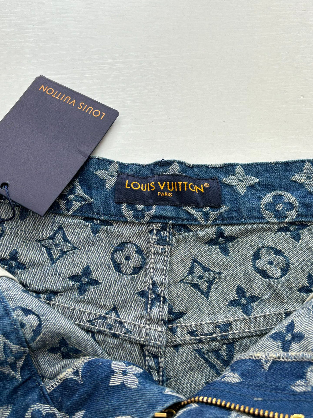 Louis Vuitton denim shorts with blue monogram print, button and zipper
