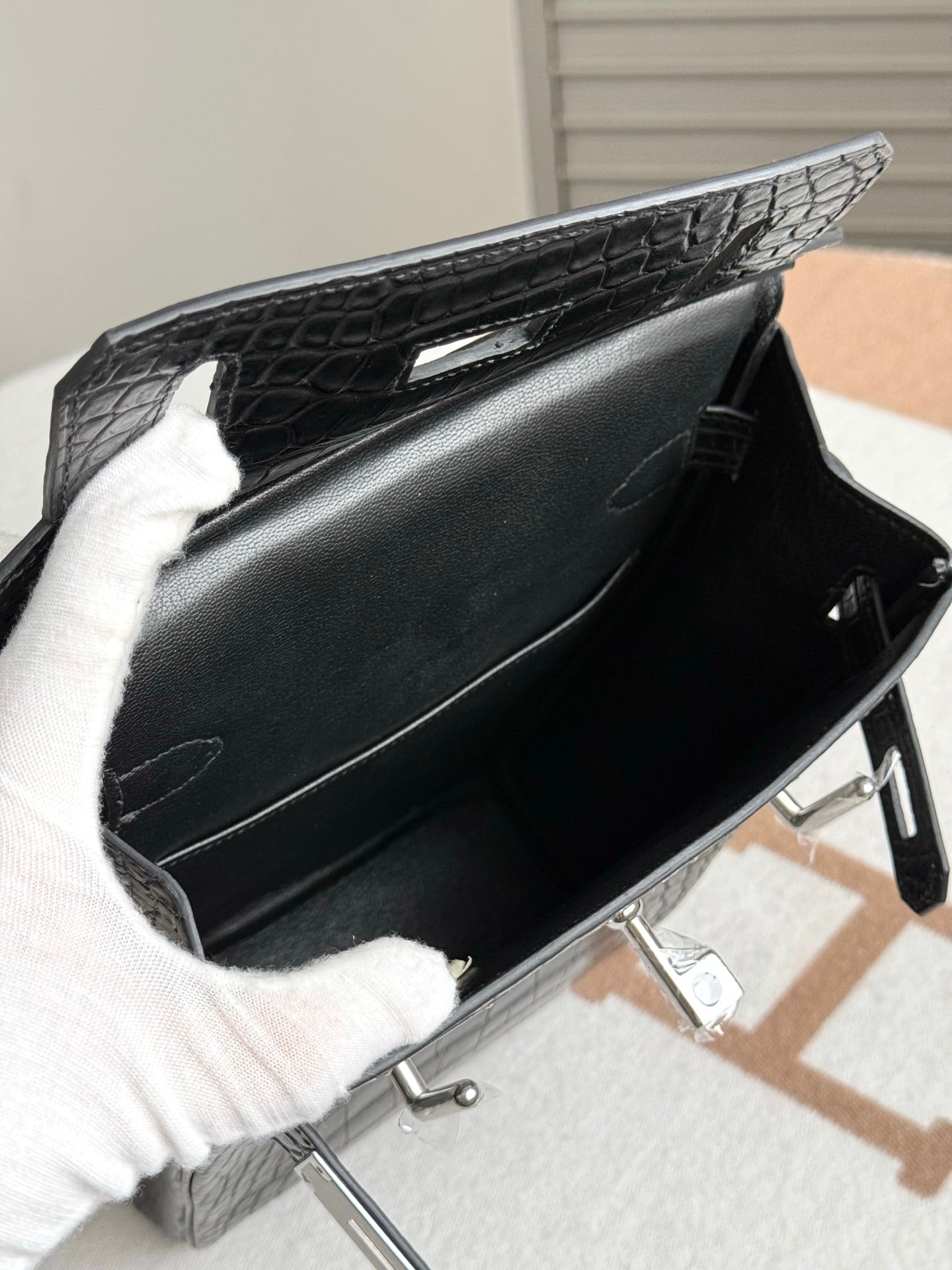 Hermes dark crocodile-embossed leather handbag open top with interior view