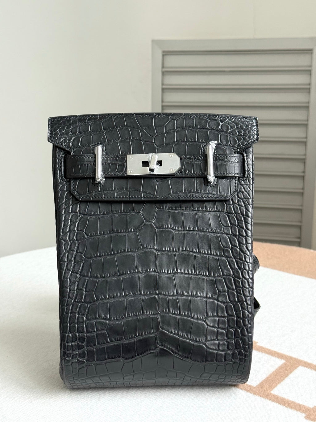 Hermes dark crocodile-embossed leather handbag with top flap and silver clasp