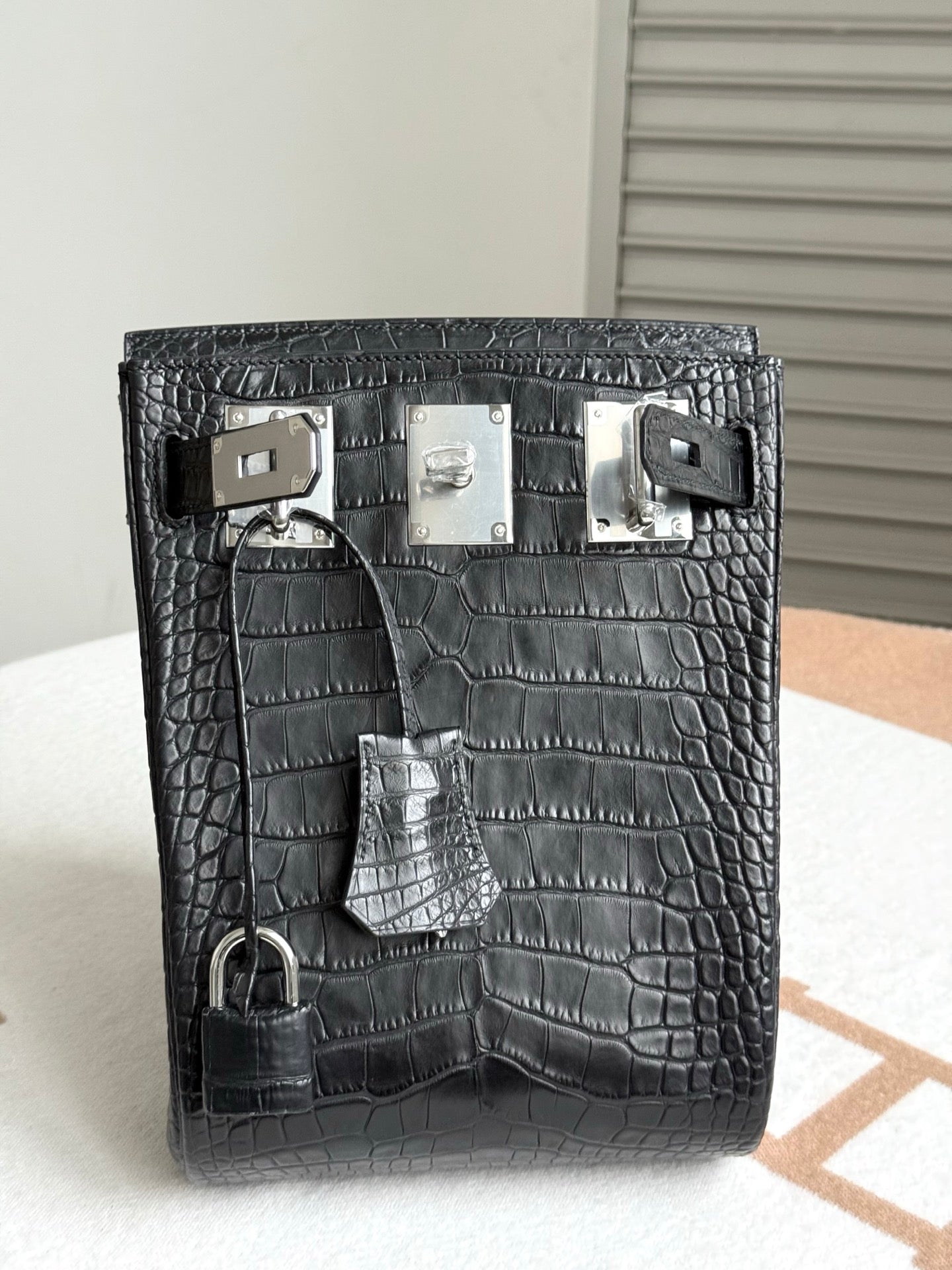 Hermes dark crocodile-embossed leather handbag with multiple front buckles