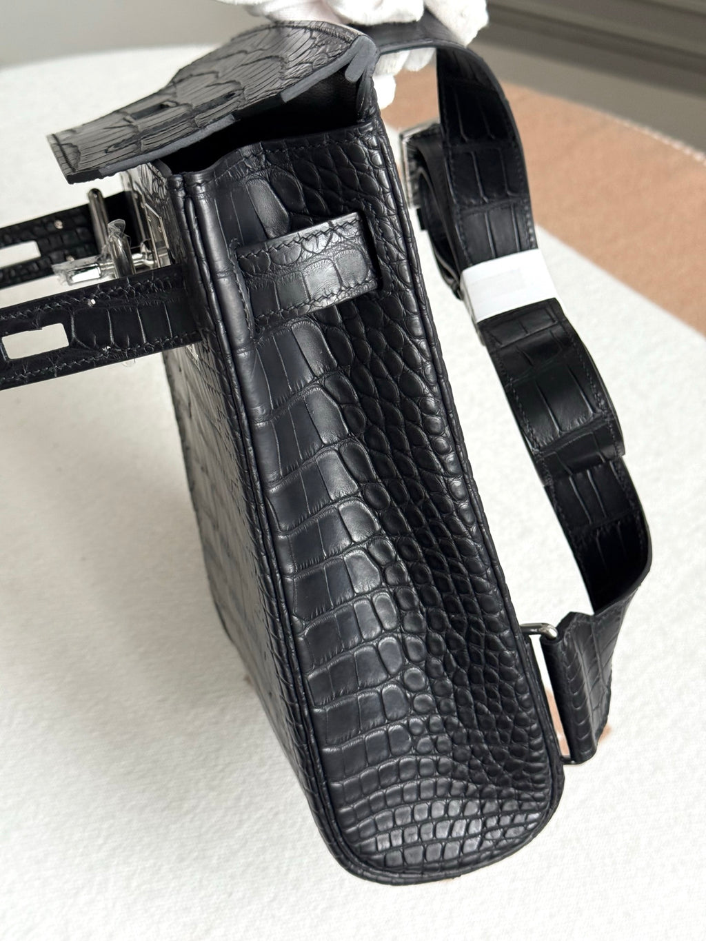 Hermes dark crocodile-embossed leather handbag, side pocket and strap hardware