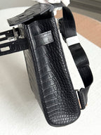 Hermes dark crocodile-embossed leather handbag, side pocket and strap hardware