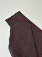 Gucci patterned pants with allover check-style fabric, folded