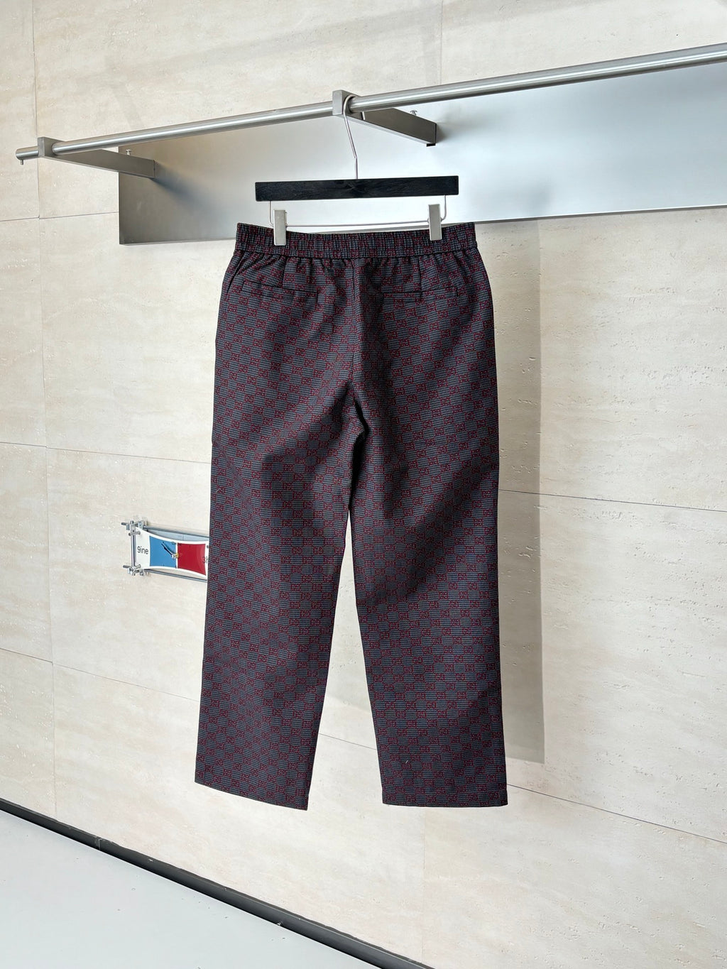 Gucci patterned pants on hanger, elastic waistband and straight leg