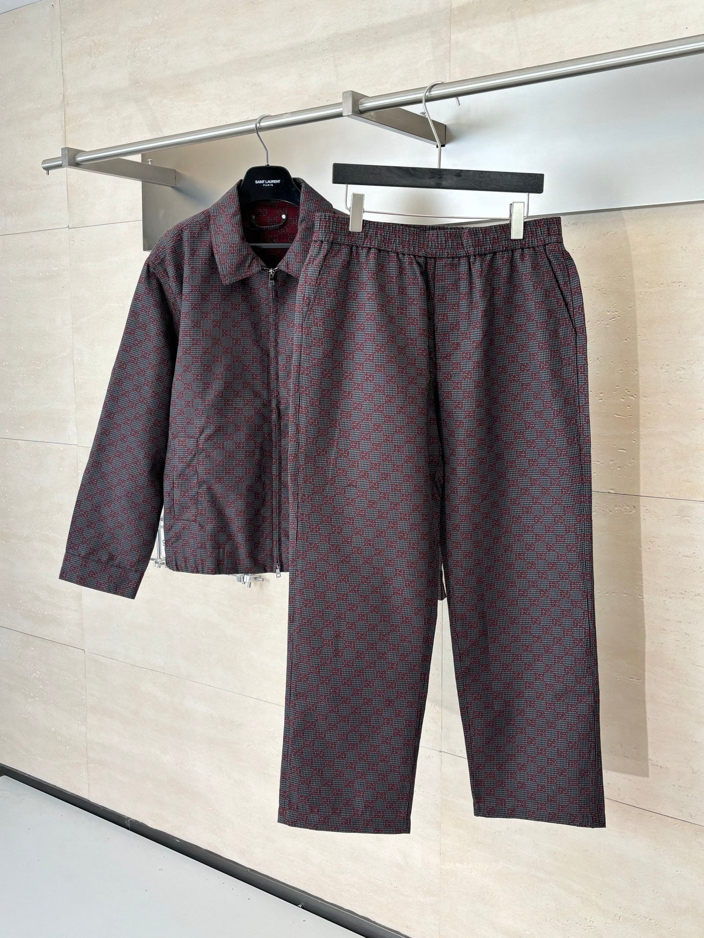 Gucci patterned set: dark shirt and matching pants on hanger