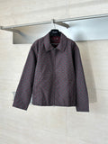 Gucci long-sleeve jacket with maroon and dark allover pattern, full zipper, collared neck.