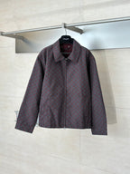 Gucci long-sleeve jacket with maroon and dark allover pattern, full zipper, collared neck.