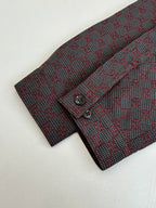 GG-pattern button-up shirt cuff with button and placket, red and gray