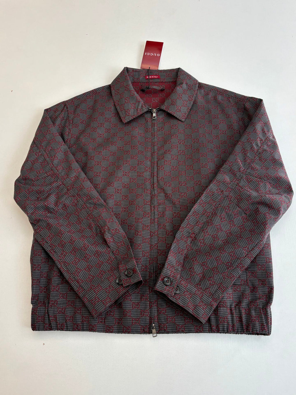 Gucci patterned zip jacket, maroon and dark, pointed collar and buttoned cuffs.