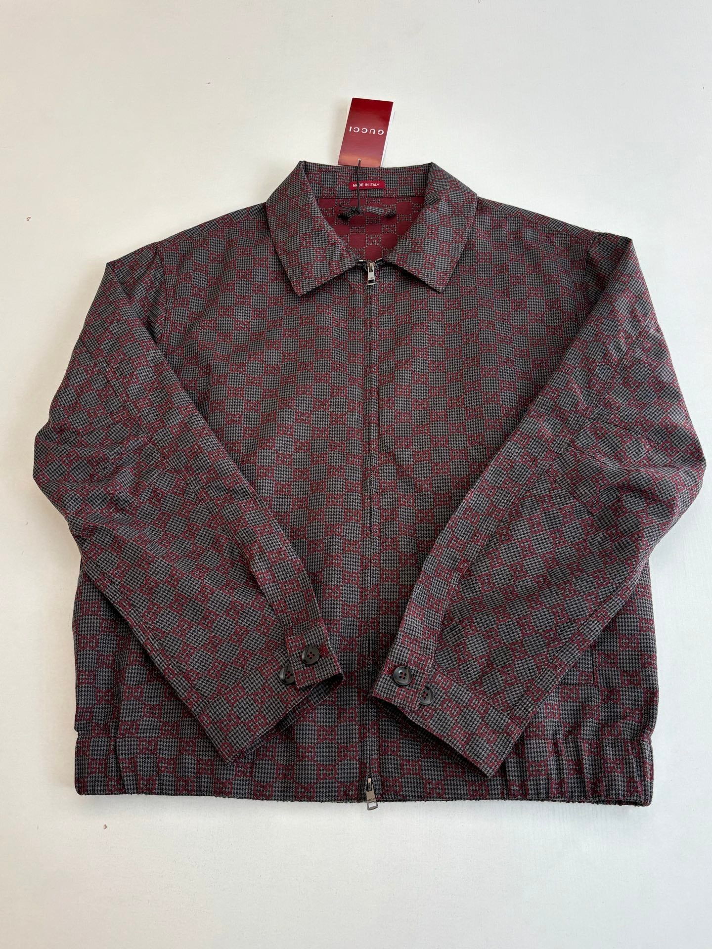 Gucci patterned zip jacket, maroon and dark, pointed collar and buttoned cuffs.