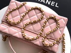 Light pink quilted bag close-up with gold-tone chain straps and CHANEL logo