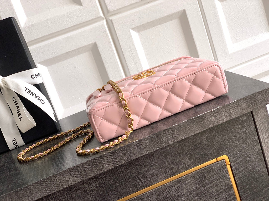 Light pink quilted bag with gold-tone chain strap and front flap with metal turn-lock