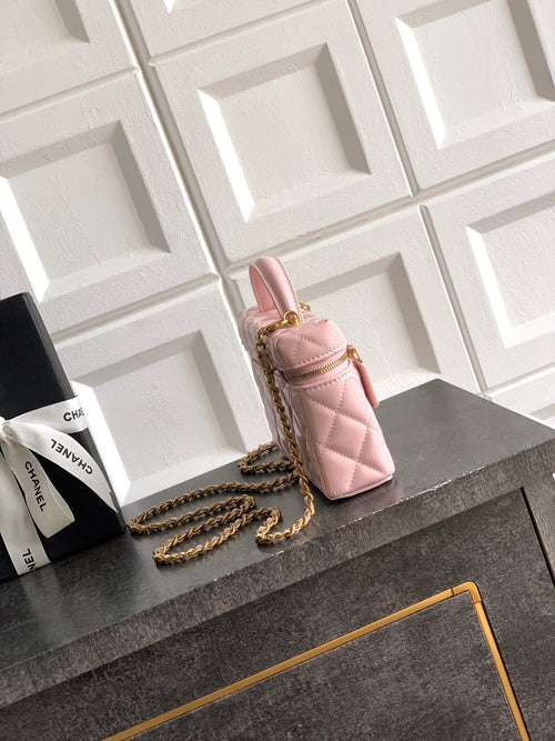 Light pink quilted bag with stacked chain strap and side view, gold-tone hardware