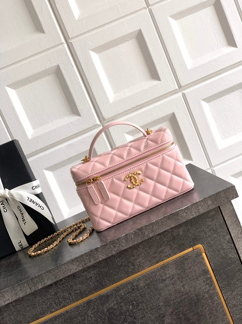 Light pink quilted bag with top handle and gold-tone chain strap, front flap closure