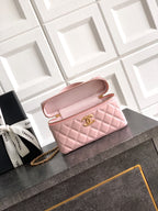 Light pink quilted bag with open flap, gold-tone chain strap and top zipper closure