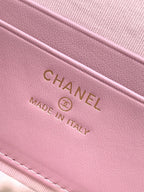 Light pink leather bag close-up showing CHANEL and 'Made in Italy' stamp