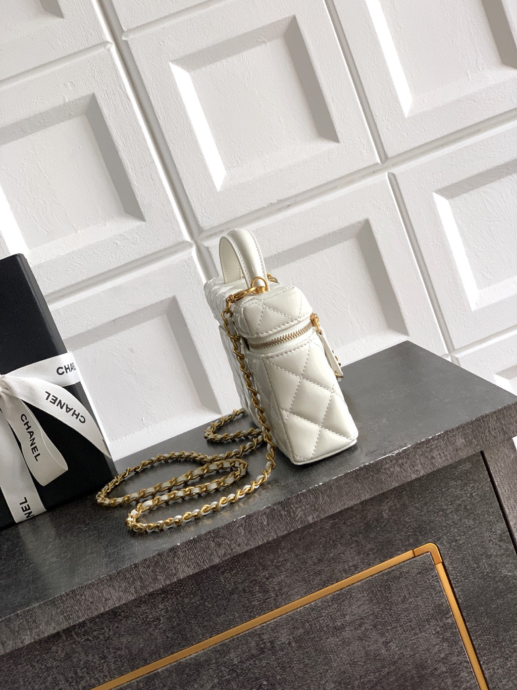 Chanel mini quilted handbag in light cream with chain strap and gold clasp