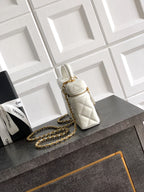 Chanel mini quilted handbag in light cream with chain strap and gold clasp