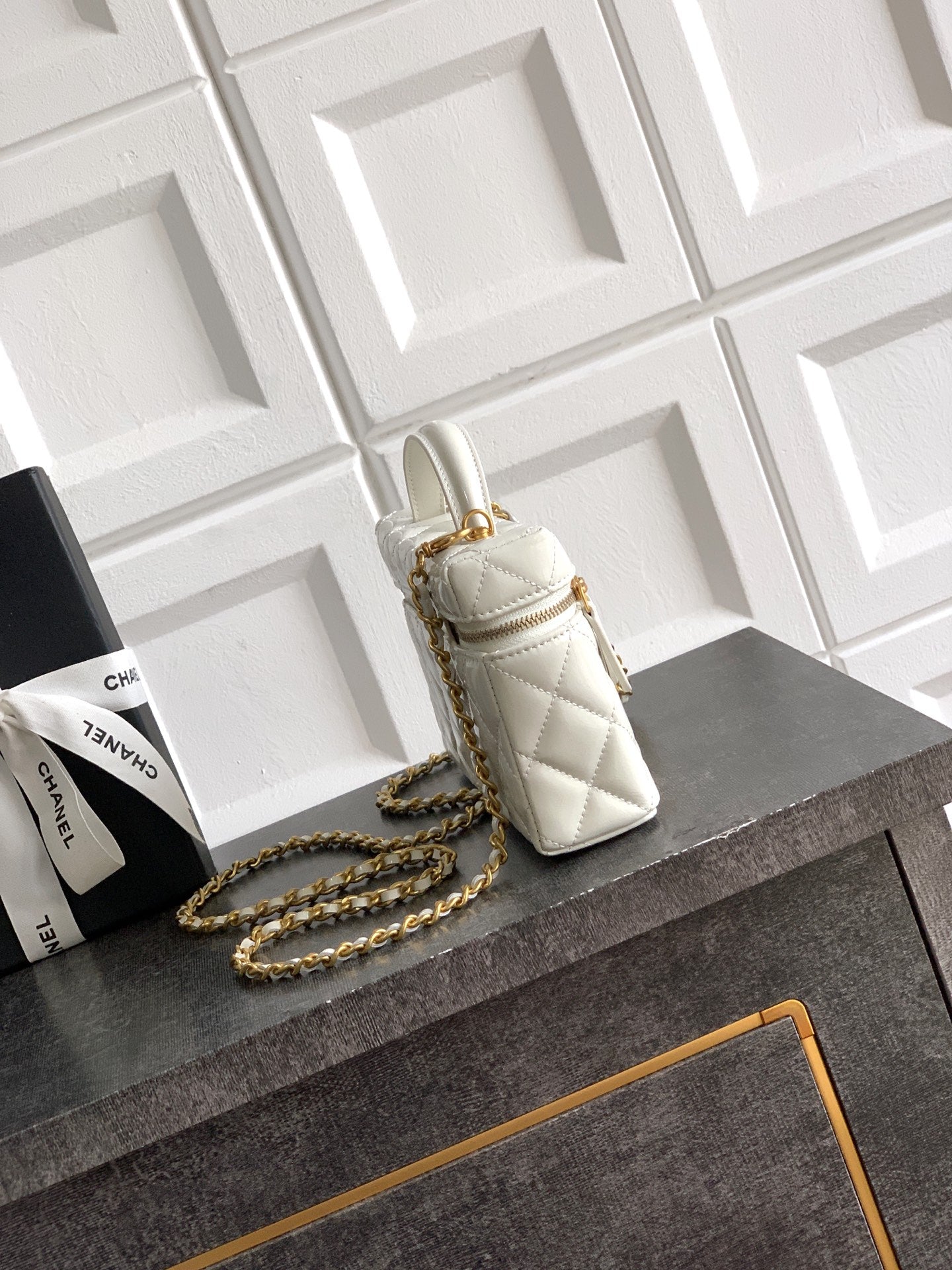 Chanel mini quilted handbag in light cream with chain strap and gold clasp