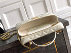 Chanel quilted pouch bag in light cream with gold zipper and chain handle