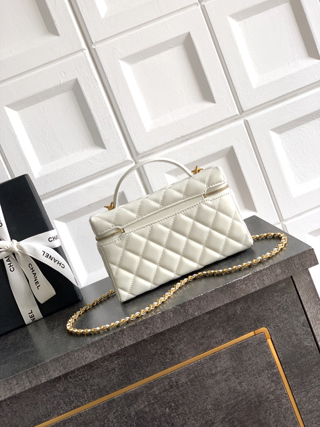 Chanel quilted handbag in light cream with chain strap and top handle