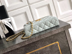 Light blue Chanel quilted bag with gold chain strap and top handle