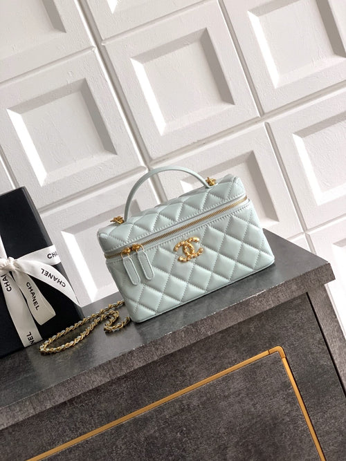 Light blue Chanel quilted shoulder bag with gold chain and top handle