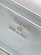 Light blue Chanel bag label reading "Made in Italy" on fabric lining